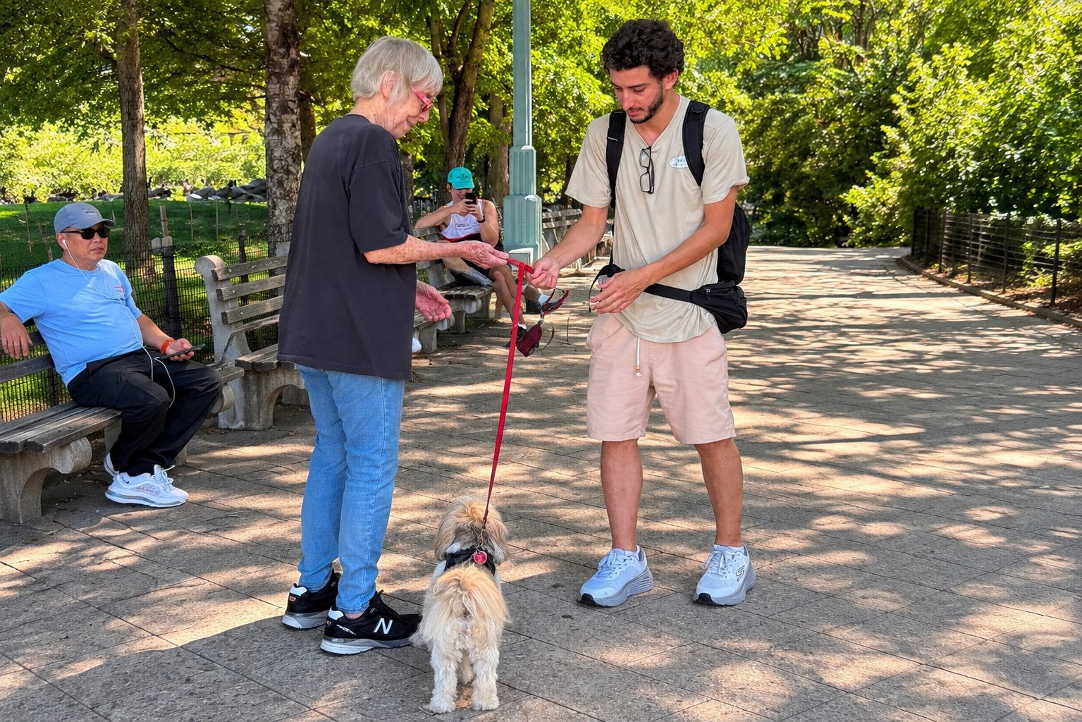 Kyle meeting a dog and its owner at a Meet and Greet